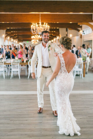 A bride and groom dancing.